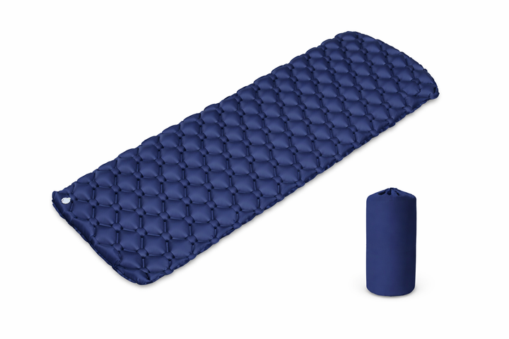 Blue quilted sleeping pad with a smaller blue sleeping pad rolled up on a white background