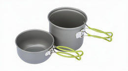 Two gray camping pots with green handles on a white background