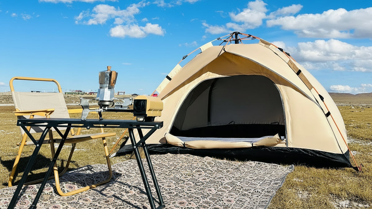 Beige tent with outdoor furniture under a blue sky with clouds